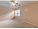Cozy bedroom with a ceiling fan and a window that provides natural light at 915 Chipley Ct, Marietta, GA 30062