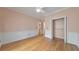 Spacious bedroom features neutral walls, ample closet space, and hardwood flooring at 915 Chipley Ct, Marietta, GA 30062