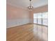 Elegant dining room featuring hardwood floors, paneled walls, and a decorative chandelier at 915 Chipley Ct, Marietta, GA 30062