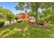 A charming brick home features a well-manicured lawn and mature trees, enhancing its curb appeal at 915 Chipley Ct, Marietta, GA 30062