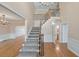 Grand foyer featuring a staircase, hardwood floors, and elegant chandelier at 915 Chipley Ct, Marietta, GA 30062