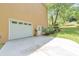 Side view of the house featuring a two car garage, as well as a walk out door at 915 Chipley Ct, Marietta, GA 30062