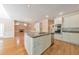 Eat in kitchen with white cabinets, granite counters, and hardwood floors at 915 Chipley Ct, Marietta, GA 30062