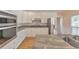 Modern kitchen with stainless steel appliances, granite counters, and white cabinets at 915 Chipley Ct, Marietta, GA 30062