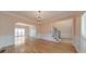 Elegant living room with hardwood floors, chandelier, and view of the staircase at 915 Chipley Ct, Marietta, GA 30062