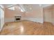 Open living room featuring a cozy fireplace, hardwood floors, and plenty of natural light at 915 Chipley Ct, Marietta, GA 30062