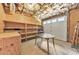 Unfinished basement with garage door and built-in shelving at 915 Chipley Ct, Marietta, GA 30062