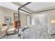 Comfortable bedroom featuring a canopy bed, seating area and stylish decor at 145 15Th Ne St # 409, Atlanta, GA 30309