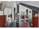Hallway leading to living area with stylish tile flooring and a book shelf along the mirrored wall at 145 15Th Ne St # 409, Atlanta, GA 30309