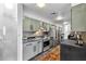 Galley kitchen featuring stainless steel appliances, stylish backsplash, and ample cabinet space at 145 15Th Ne St # 409, Atlanta, GA 30309