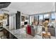 Open living space with marble floors and a large window, complemented by modern furnishings and decor at 145 15Th Ne St # 409, Atlanta, GA 30309