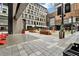 View of a modern city plaza with vibrant outdoor seating, landscaping, and architectural details at 145 15Th Ne St # 409, Atlanta, GA 30309