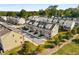 Aerial view showcases new townhome community with well-manicured landscaping at 1590 Ridgebrook Downs, Mableton, GA 30126
