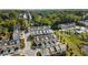 Aerial view of a townhome community with a pool, pond, and green spaces at 1590 Ridgebrook Downs, Mableton, GA 30126