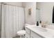 Bathroom features a toilet, shower with modern curtain and a white vanity at 1590 Ridgebrook Downs, Mableton, GA 30126