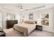 Spacious bedroom features a tray ceiling, ceiling fan, and ample natural light from two windows at 1590 Ridgebrook Downs, Mableton, GA 30126