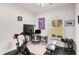 Bright exercise room with a Peloton bike, free weights, weight bench and natural light at 1590 Ridgebrook Downs, Mableton, GA 30126