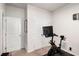 Exercise room with doors, a Peloton bike, and carpeted floor at 1590 Ridgebrook Downs, Mableton, GA 30126