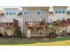 Townhome rear exterior with wooden decks and manicured lawn at 1590 Ridgebrook Downs, Mableton, GA 30126