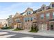 Attractive townhomes showcase brick facades, two-car garages, and well-maintained landscaping at 1590 Ridgebrook Downs, Mableton, GA 30126