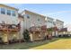 Townhome exterior with wooden decks, lower level entry, and lawn at 1590 Ridgebrook Downs, Mableton, GA 30126