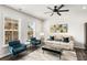 Sunlit living room featuring modern furniture, large windows, and neutral color palette at 1590 Ridgebrook Downs, Mableton, GA 30126