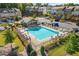 Community pool surrounded by lounge chairs and well-maintained landscaping at 1590 Ridgebrook Downs, Mableton, GA 30126