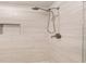 Shower featuring modern tile, recessed niche, and adjustable shower head at 1590 Ridgebrook Downs, Mableton, GA 30126