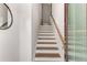 Staircase leads upstairs with wood stairs, white risers, wood handrail and white walls at 1590 Ridgebrook Downs, Mableton, GA 30126