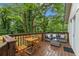 Inviting back deck with stylish seating, ideal for enjoying the peaceful, wooded surroundings at 1927 Willa Way, Decatur, GA 30032