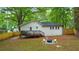 Spacious backyard showcasing a deck and a fire pit area, creating a perfect outdoor oasis at 1927 Willa Way, Decatur, GA 30032
