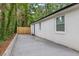 Private backyard featuring a newly constructed wooden fence and a level concrete patio area at 1927 Willa Way, Decatur, GA 30032