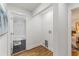 A bathroom and laundry room with hexagonal tiles and a tiled shower/tub at 1927 Willa Way, Decatur, GA 30032