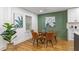 Inviting dining area adjacent to kitchen, featuring stylish seating, modern lighting, and hardwood floors at 1927 Willa Way, Decatur, GA 30032