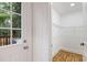 Bright walk-in closet with wood floor and wire shelves adjacent to the back door at 1927 Willa Way, Decatur, GA 30032