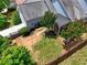 Aerial view of the backyard including a lawn, patio, and lush landscaping that offers outdoor enjoyment at 207 Harmony Lake Dr, Canton, GA 30115