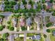 An aerial view shows a quiet neighborhood with tree-lined streets and well-maintained homes at 207 Harmony Lake Dr, Canton, GA 30115