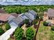 Aerial view of home with a large backyard, mature trees, fence, and neighborhood setting at 207 Harmony Lake Dr, Canton, GA 30115