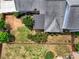 Aerial view of a home with a well-maintained yard, fence, and patio area at 207 Harmony Lake Dr, Canton, GA 30115