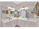 Bright bathroom featuring double sink vanity with ample counter space and storage at 207 Harmony Lake Dr, Canton, GA 30115