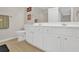 Bathroom featuring a long vanity with cabinet space, toilet, and tile floors at 207 Harmony Lake Dr, Canton, GA 30115
