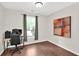 Bedroom with hardwood flooring and space for a desk at 207 Harmony Lake Dr, Canton, GA 30115