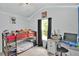 Bedroom featuring a bunkbed and an adjacent desk and study area at 207 Harmony Lake Dr, Canton, GA 30115