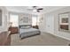 Comfortable bedroom with neutral carpet, ceiling fan, and double door closet at 207 Harmony Lake Dr, Canton, GA 30115