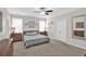 Spacious bedroom with neutral walls, carpet, and a modern ceiling fan at 207 Harmony Lake Dr, Canton, GA 30115