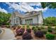 Beautiful clubhouse with white siding, stone accents, and landscaped grounds in a lush, green community at 207 Harmony Lake Dr, Canton, GA 30115