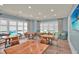 Bright common area with hard surface floors and many tables by the windows at 207 Harmony Lake Dr, Canton, GA 30115