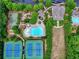 Aerial view showcasing the community's pool, tennis courts, playground, and well-kept grounds at 207 Harmony Lake Dr, Canton, GA 30115