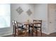 Dining room features hardwood floors, wainscoting, and decorative lighting at 207 Harmony Lake Dr, Canton, GA 30115