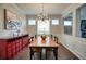 Well-lit dining room featuring hardwood floors and wainscoting with a view into another room at 207 Harmony Lake Dr, Canton, GA 30115